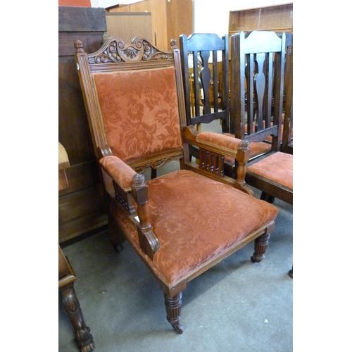 168 - A Victorian carved walnut and fabric upholstered armchair