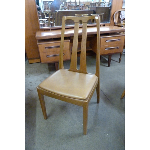 17 - A Nathan teak extending table and four chairs