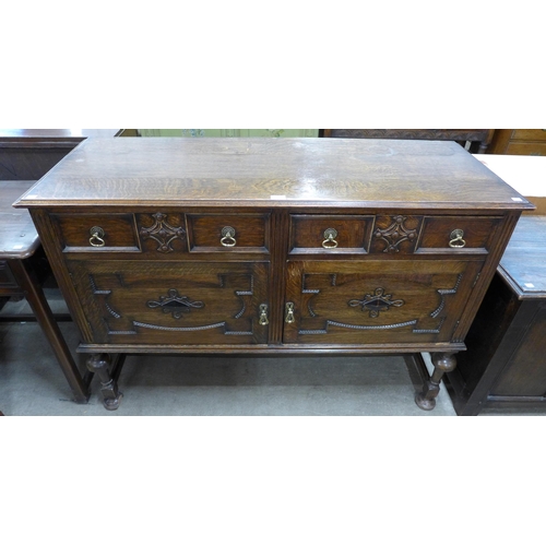 188 - A 17th Century style carved oak sideboard