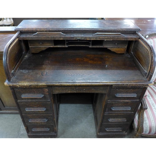 193 - An early 20th Century oak tambour roll top desk