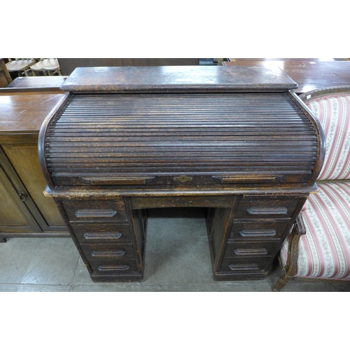 193 - An early 20th Century oak tambour roll top desk