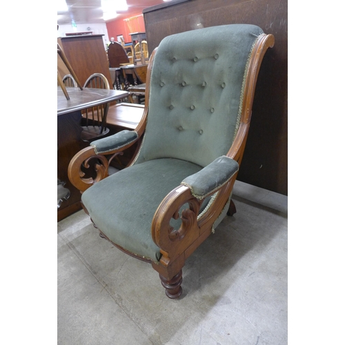 201 - A Victorian carved mahogany and upholstered open armchair