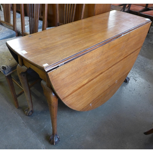 206 - A George III mahogany drop-leaf dining table and six chairs