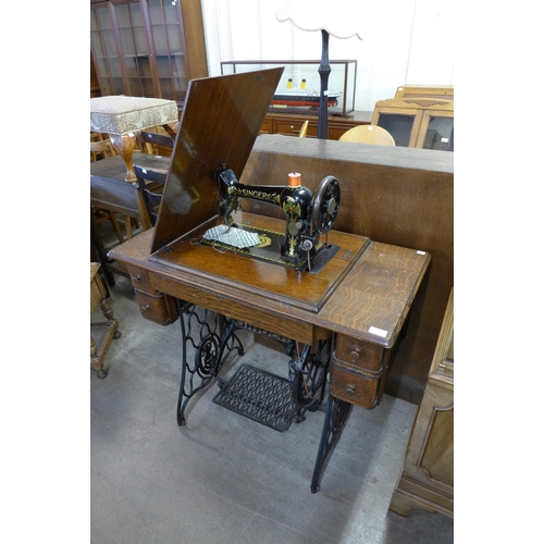 213 - An oak Singer treadle sewing machine