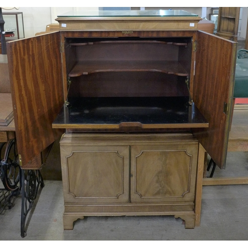 214 - A mahogany four door cocktail cabinet