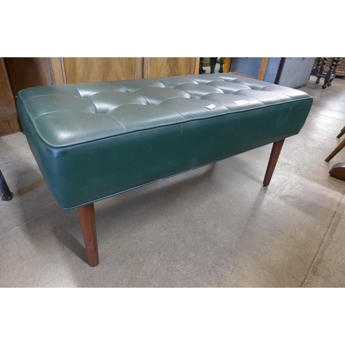 216 - A green leather footstool