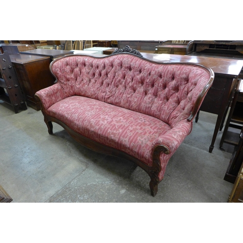 231 - A French carved mahogany and fabric upholstered settee