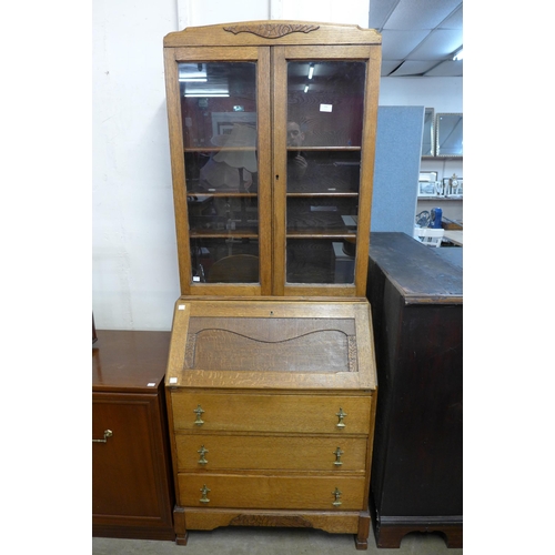 236 - An oak bureau bookcase