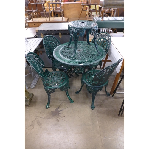 254 - A Victorian style painted cast alloy garden table, four chairs and a stool