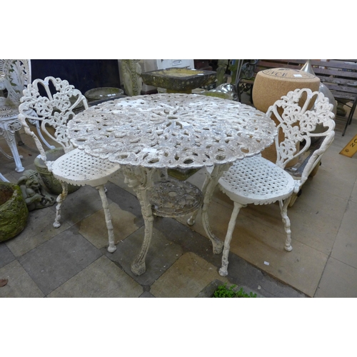 264 - A Victorian style painted cast alloy garden table and two chairs