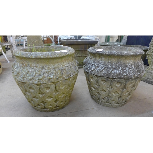 274 - A pair of Celtic style concrete garden urns