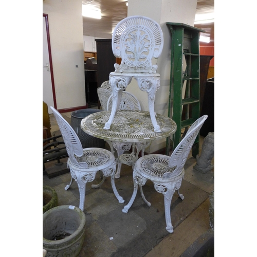 279 - A Victorian style painted wrought alloy garden table and four chairs