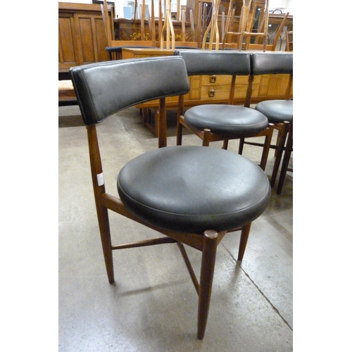 29 - A set of eight G-Plan Fresco teak and black vinyl dining chairs