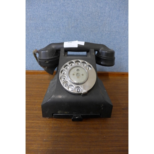 310 - A vintage black Bakelite telephone