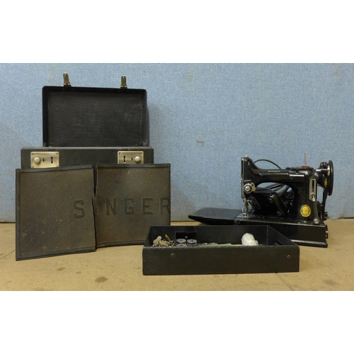 311 - A vintage Singer portable sewing machine, No. 221K