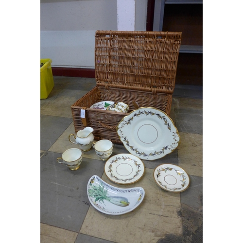 336 - A wicker basket containing chinaware