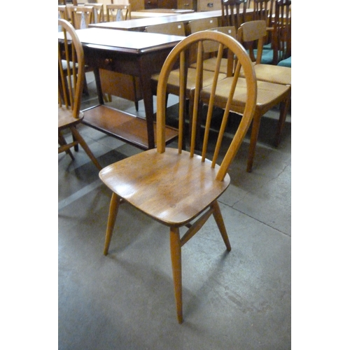 55 - A set of three Ercol Blonde elm and beech Windsor chairs