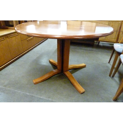 59 - A circular rosewood effect extending dining table