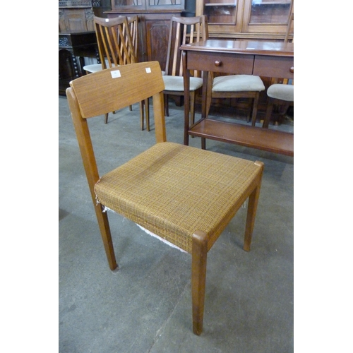 62 - A set of four teak dining chairs