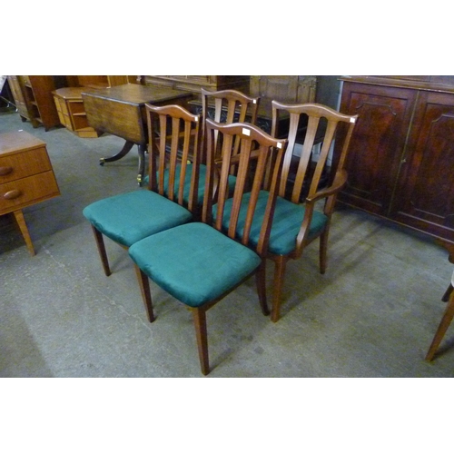 63 - A set of four teak dining chairs