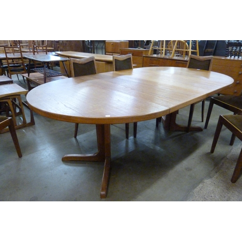 95 - A Danish teak extending dining table and six G-Plan Fresco teak dining chairs