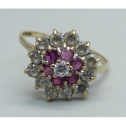 1006 - A ruby and white stone cluster ring