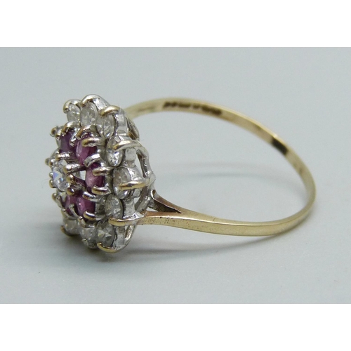 1006 - A ruby and white stone cluster ring