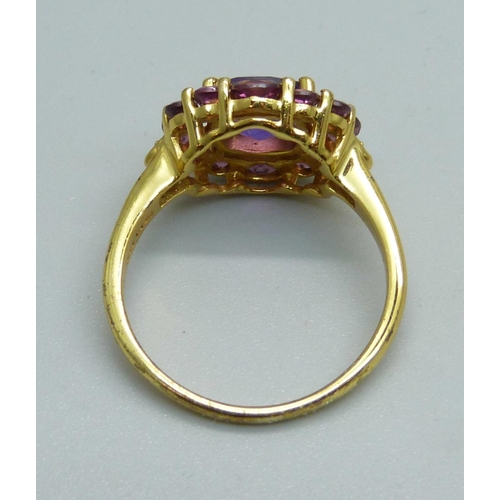 1016 - A silver gilt, checkerboard cut amethyst and pink tourmaline ring, S