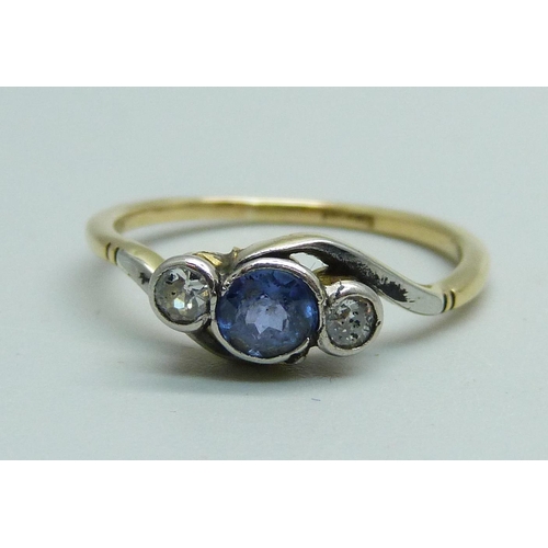 1027 - An 18ct gold sapphire and diamond three stone ring, 2.2g, N