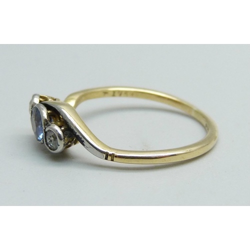 1027 - An 18ct gold sapphire and diamond three stone ring, 2.2g, N