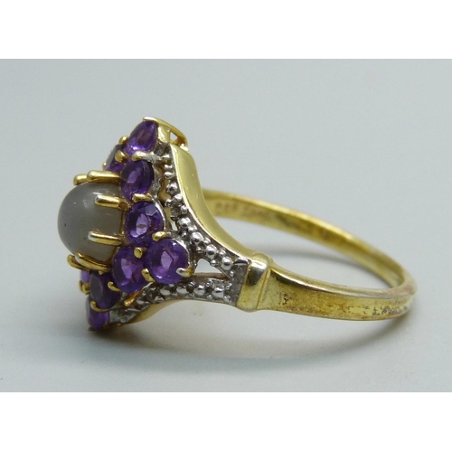 1034 - A silver gilt, amethyst and moonstone ring