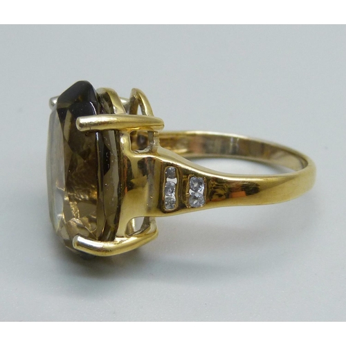 1036 - A silver gilt, smoky quartz and ten white stone ring, O