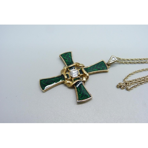 1044 - A silver gilt and green enamel Celtic style cross on chain