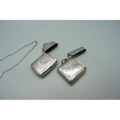 1067 - Two silver vesta cases and a 19th Century bottle label, 'raspberry'