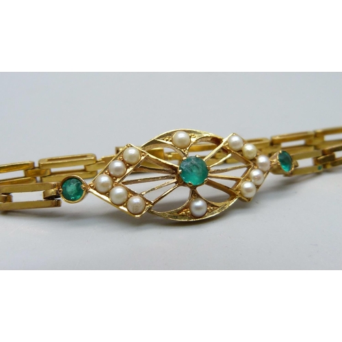 1072 - A yellow metal, seed pearl and green stone set bracelet, 11.3g