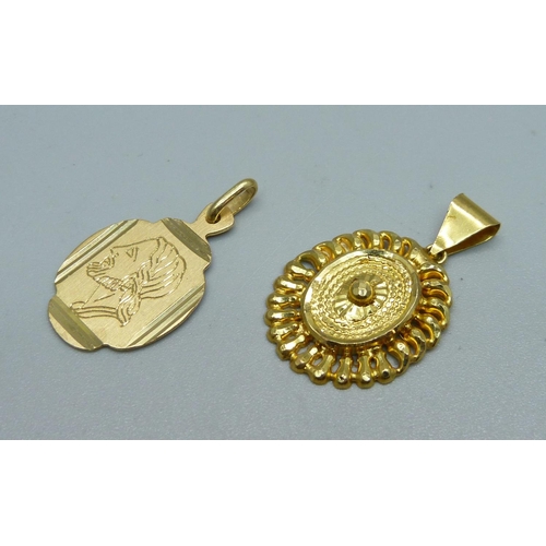 1089 - An 18ct gold pendant, marked 750, 2.5g, and a yellow metal pendant, 1.9g