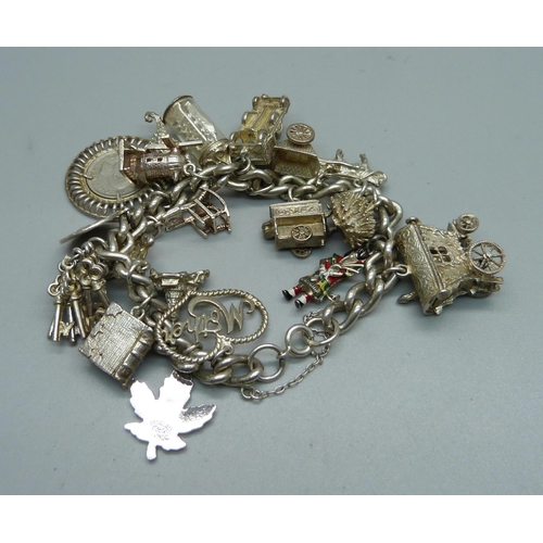 1151 - A silver charm bracelet, 82g