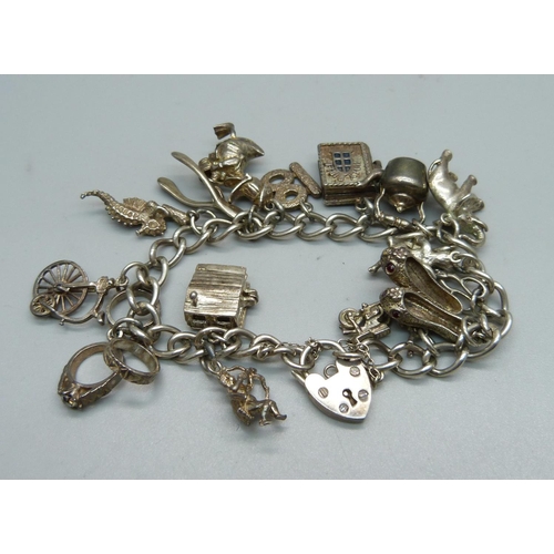 1152 - A silver charm bracelet, 52g