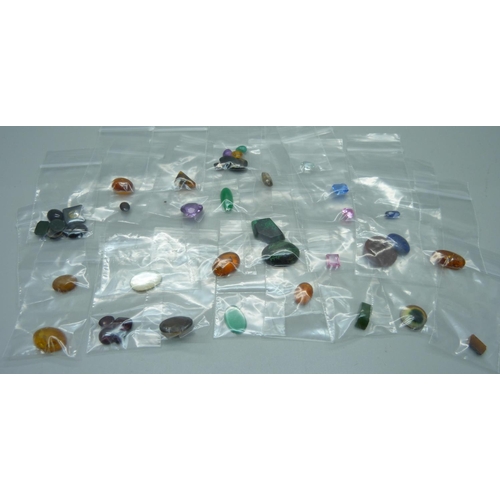 1164 - Unmounted gemstones including amber, garnet, amethyst, etc.