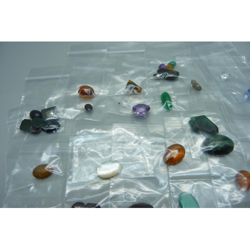 1164 - Unmounted gemstones including amber, garnet, amethyst, etc.