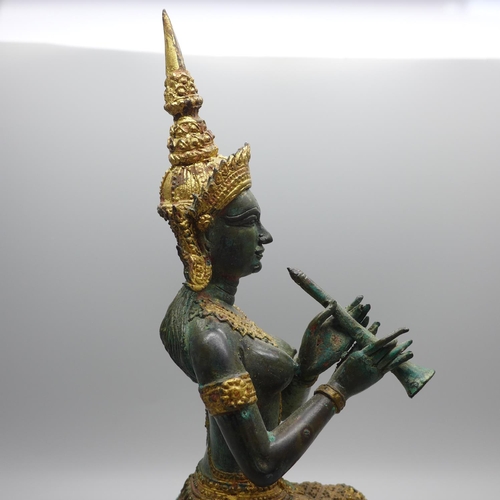 610 - A Thai bronze Krishna flute player figure, 25cm