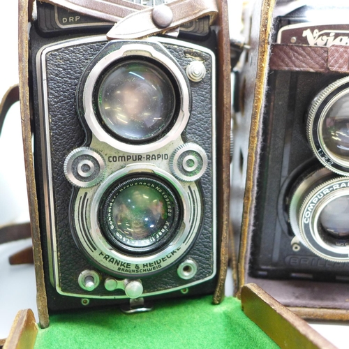 649 - Two Rolleiflex TLR cameras, one with Carl Zeiss lenses, cased and a Voigtlander TLR camera, cased