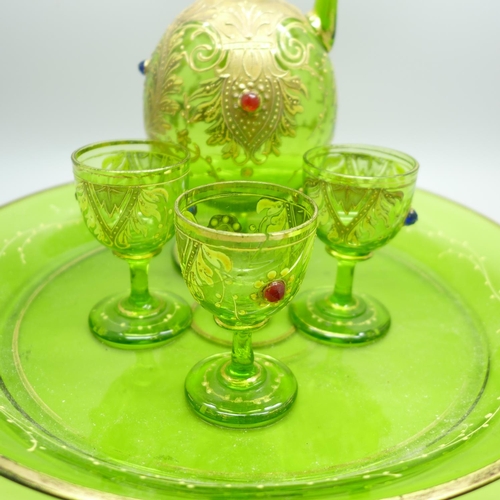 669 - A 19th Century green glass decanter, three glasses, glass tray, one glass and decanter a/f