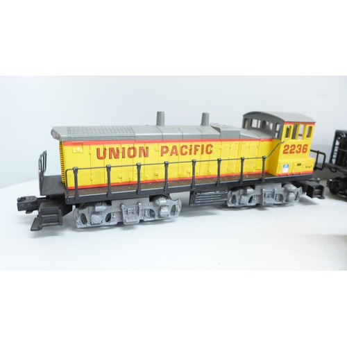 688 - A K-Line O gauge diesel locomotive and 5 hopper wagons