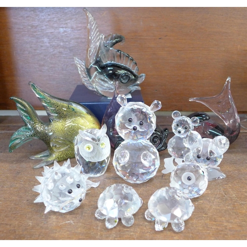 690 - A collection of Swarovski crystal animals, four glass fish and a Stuart Crystal paperweight