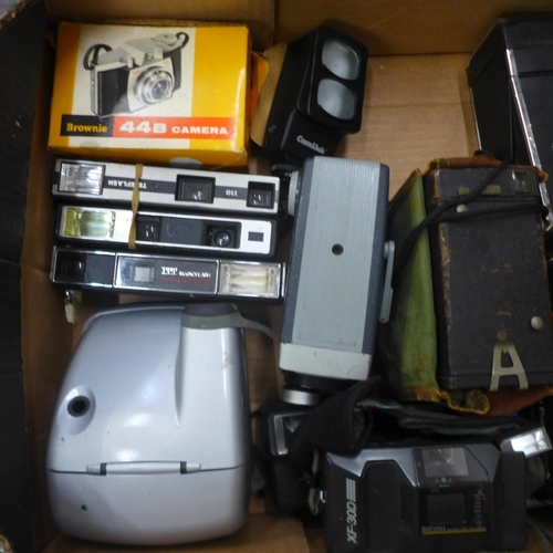 731 - A collection of cameras and camera slides, slides include a 1970s motor show and European travel