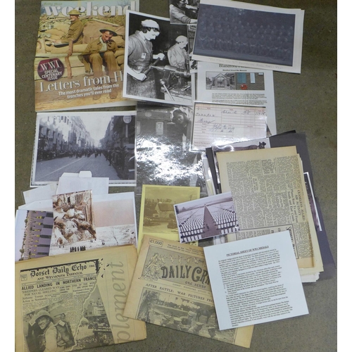 761 - A folder of WWI and WWII reproduction ephemera
