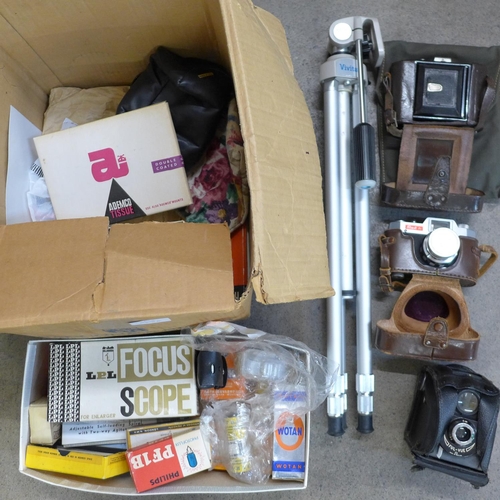 778 - Three vintage cameras and a box of camera and dark room accessories including a tripod
