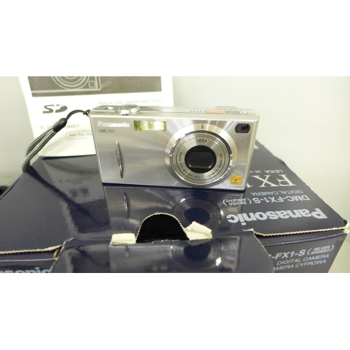 795 - A Panasonic FX1 digital camera with accessories and a pair of Europa 8x30 binoculars, boxed