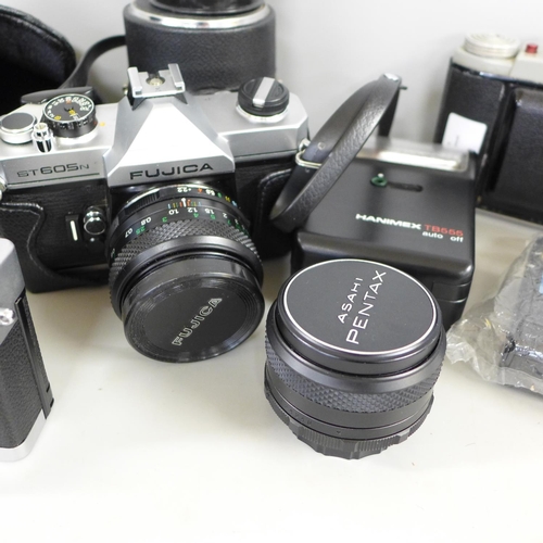 801 - A Fujica 35mm film camera, six other cameras, lenses and flash gun